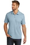 Blue branded polo by TravisMatthew