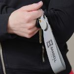 Custom Never Lost Strap Keychain Branded in Hand